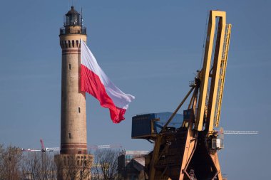 STATE FLAG - Flag of Poland at the lighthouse in Swinoujscie