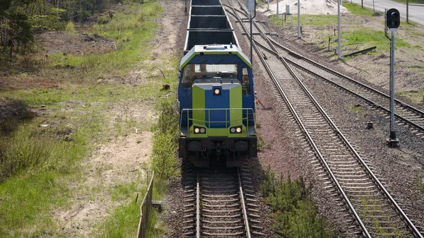 LOCOMOTIVE ON THE RAILROAD - Transportation of minerals by wagons