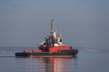 FIREBOAT - Red rescue ship is sailing on the bay