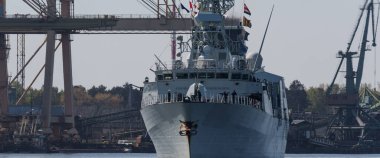 SWINOUJSCIE, WEST POMERANIAN - PLAND - 2022: A Canadian Navy frigate flows  from the port to  sea