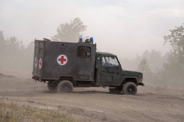 MILITARY AMBULANCE - Polish all-terrain vehicle on a dirt road
