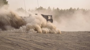 TRACKED ARTILLERY TRACTOR - Military vehicle on a dirt road