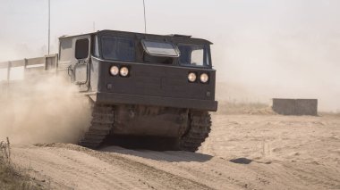 TRACKED ARTILLERY TRACTOR - Military vehicle on a dirt road