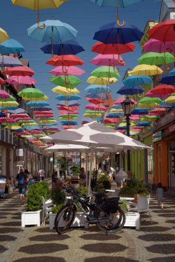 POLCZYN ZDROJ, WEST POMERANIAN - 2022: A cafe in a walking passage under colorful umbrellas