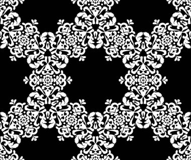 Siyah arkaplanda beyaz dantel çiçek süsü.