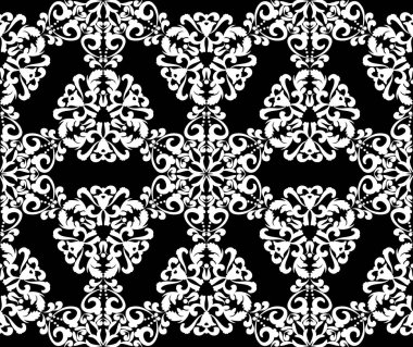 Siyah arkaplanda beyaz dantel süs. 