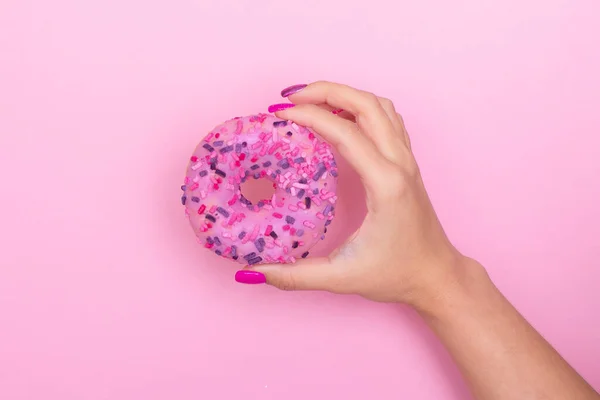Female Hand Pink Manicure Nails Holding Strawberry Donut — Stock Photo, Image