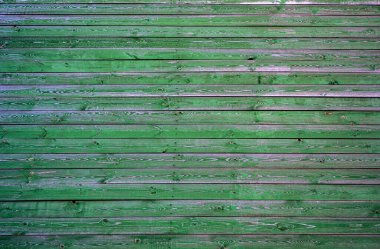 Eski bir yüzeyi olan ahşap bir duvar. Eski bir duvar ve koyu ahşaptan yapılmış zemin, gerçekçi tahta dokusu. Boş oda iç arkaplanı.