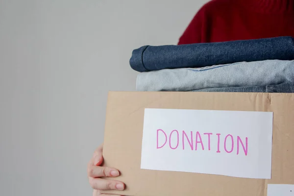 Woman Holding Donate Box Full Clothes — Stock Photo, Image