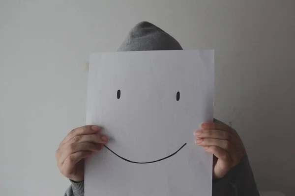 Woman Holding Smiling Face Emoticon Front Face Gray Background Depression — Stockfoto