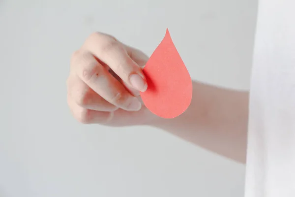 Hand Holding Blood Shape Made Paper White Background Copy Space — Foto de Stock