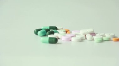 Woman holding pills in hand. Woman suicide by taking overdose medicines.Young woman is major depressive disorder.