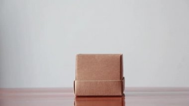 Put a paper heart in a box, deliver love and care. valentine's day