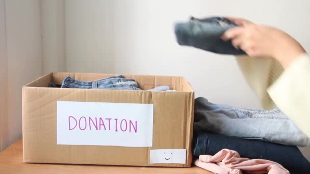 Female Put Gather Clothes Box Make Donation Needy People — Video Stock