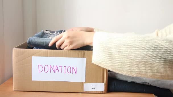 Female Put Gather Clothes Box Make Donation Needy People — ストック動画