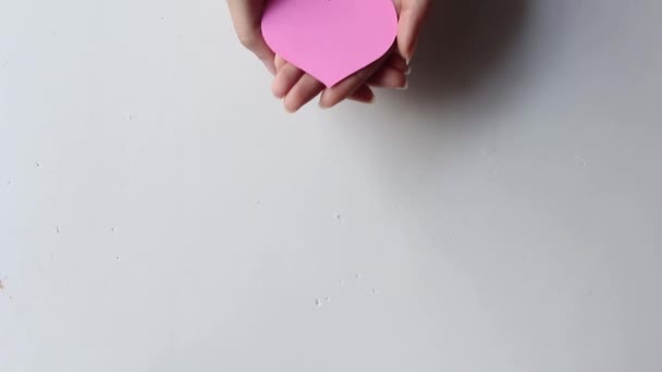Hand Holding Pink Heart White Background Healthcare Organ Donation Love — 图库视频影像