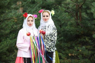Koprivshtica, Bulgaria - August 6, 2022: People in traditional folk costume of The National Folklore Fair in Koprivshtica. The National Folklore Fair in Koprivshtica is entered in the UNESCO Register of the human intangible cultural heritage