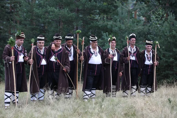 Koprivshtica, Bulgaria - August 6, 2022: People in traditional folk costume of The National Folklore Fair in Koprivshtica. The National Folklore Fair in Koprivshtica is entered in the UNESCO Register of the human intangible cultural heritage
