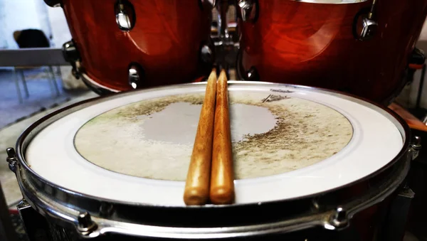 View of drumroll and wooden mallets, in the background drum kit, rock band, drum, photo