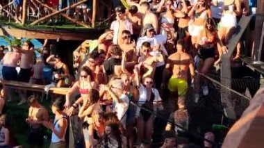 Pag, Zrce, Croatia, 22 July 2022: View of young people dancing to music in a club on the sea, summer party on the background of the sea, NOA beach club, summer fun
