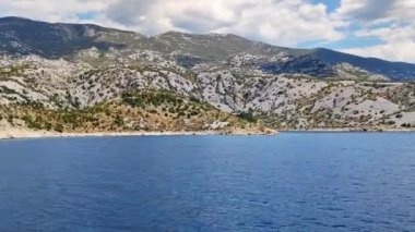 View of the Croatian coast from the moving ferry from the island of Pag, sea view