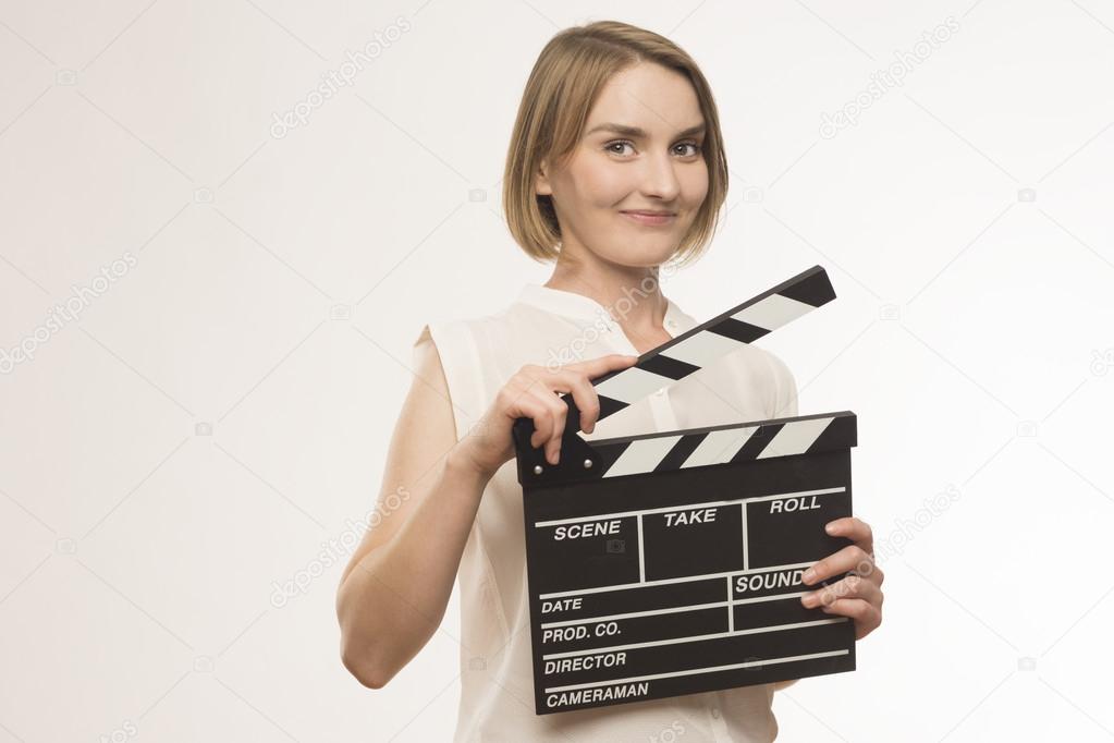 Young girl with a clapperboard cinema