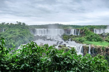 Iguazu waterfalls panoramic scenic view rainy weather . High quality photo