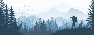 Photographer on meadow in forest take picture of deer. Silhouette of tree, man, animal, mountains. Wild nature landscape. Horizontal banner.	