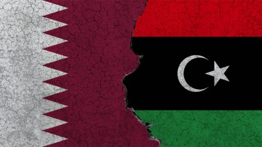 Qatar vs Libya, the flags of the two countries painted on a concrete ruined wall