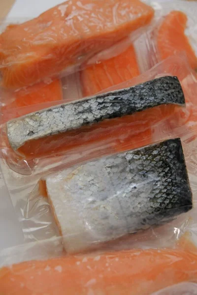 Salmon fish.Fish and seafood. fish pieces. Pieces of frozen salmon .Protein foods.Vacuum packed products