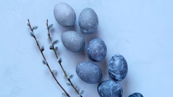 Marble Easter Eggs.Easter food. Easter eggs in gray tones and sprigs of pussy willow on a gray background.Easter holiday symbol — Wideo stockowe