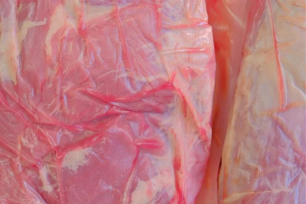 Pork meat.Fresh pork pieces . Protein foods. meat texture.Vacuum packed meat — Stock Photo, Image