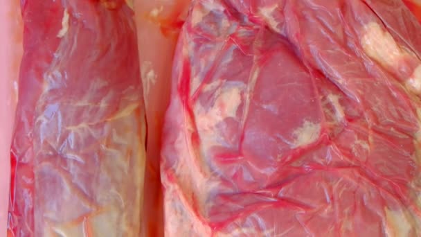 Productos cárnicos. Carne de cerdo. Carne envasada al vacío — Vídeos de Stock