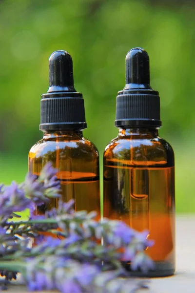 Lavender Essential Oil . Lavender oil and lavender sprigs .Organic Lavender Oil Glass Bottles.natural cosmetics — Stock Photo, Image