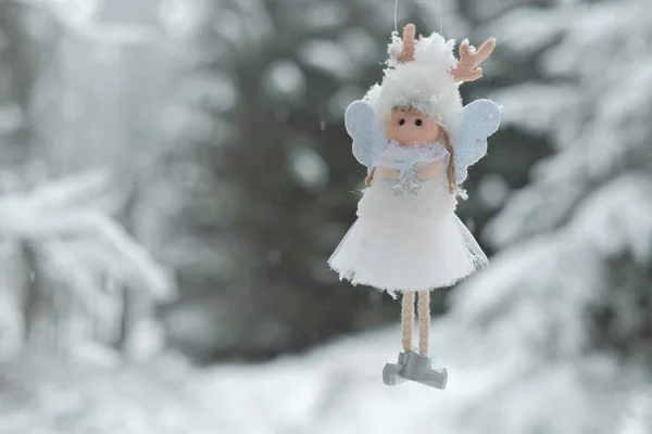 Winter angel.Christmas and New Years time.Christmas angel on a tree. Snow fairy. Christmas tree toy. — Stock Photo, Image