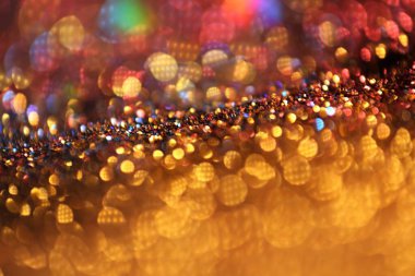 Işıldayan bokeh. Parlak bir arka plan. Parlak bir şenlik ortamı. Altın rengi ışıltı dokusu. Altın renkli güzel bokeh arkaplanı. Parlayan bokeh.. 