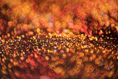 Noel arkaplanı. Işıldayan bokeh. Parlak bir arka plan. Parlak bir şenlik ortamı. Altın parıltılı kumaş. Parlayan bokeh.. 