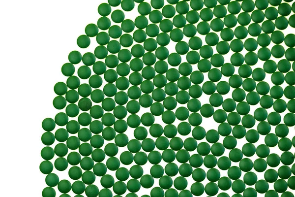 Chlorella algae green tablets isolated on white background.seaweed dietary supplements. Chlorella Powder Tablets.Spirulina algae. Alternative medicine and homeopathy.Super food concept — Stock Photo, Image