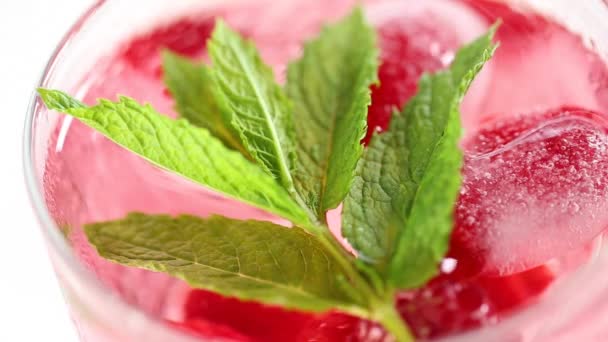 Raspberry cocktail.Summer drink. glass with raspberry drink on a white wooden table. — Wideo stockowe