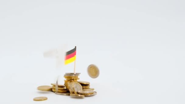 Economic recession in Germany.The declining economy of Germany. Financing in Germany.Euro banknotes and flag of Germany in euro coins on a white background.German budget — Stockvideo