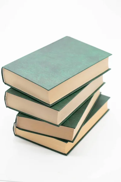 Reading of books. Books stack with green covers on a white background. Knowledge concept.Reading and education. Literature and reading — Stock Photo, Image