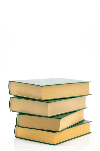 Literature and reading concept. Books stack with green covers on a white background.Reading of books. Knowledge concept.Reading and education. Literature and reading — Stockfoto