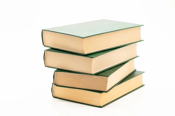 Reading and education. Books stack with green covers on a white background.Reading of books. Knowledge concept. — Stockfoto