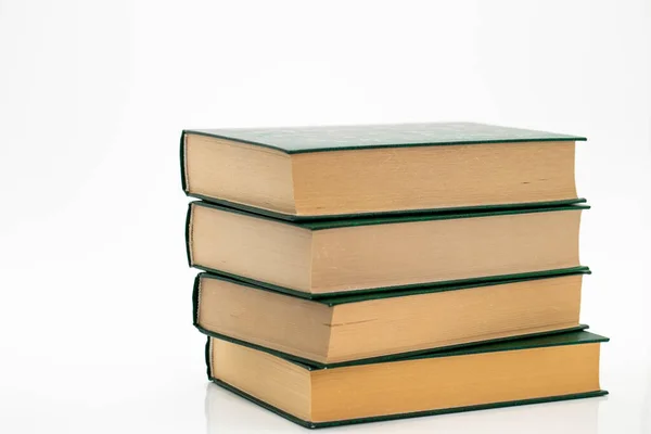 Books stack on a white background.Reading of books. Knowledge concept.Reading and education. Literature and reading — Stockfoto