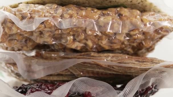 Food supply.Storage in vacuum bags. Vacuuming products for long term storage. — Stock video