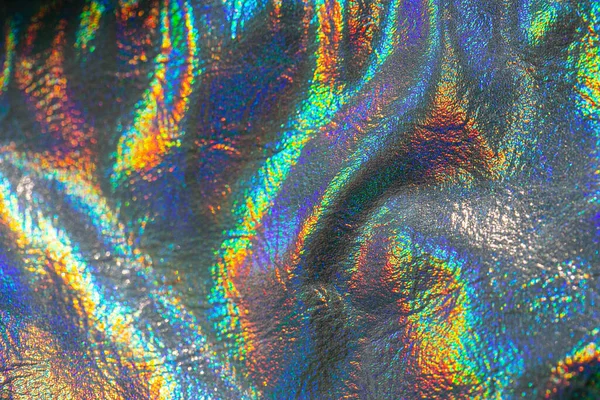 Wallpaper In silver, purple and green colors.metal holographic material.Holographic background. texture with iridescent waves and folds — Fotografia de Stock