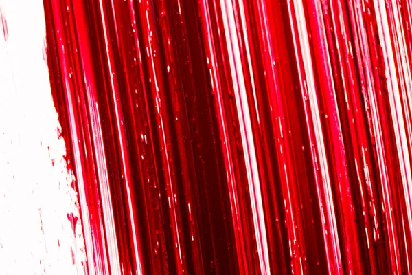 Macro rossetto rosso.Texture rossetto su fondo bianco. superficie rossa del rossetto.Trucco e prodotti cosmetici — Foto Stock