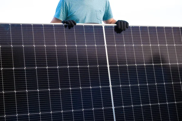 Solar energy.Green energy. Solar panel in the hands of a worker . Fitting and installation of solar panels.renewable energy. energy from nature.