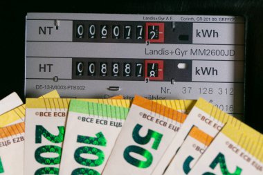  Rising electricity prices. Electricity cost in European countries. euro bills on electric meter background.Paying electricity bills in Europe. Payment for utility services