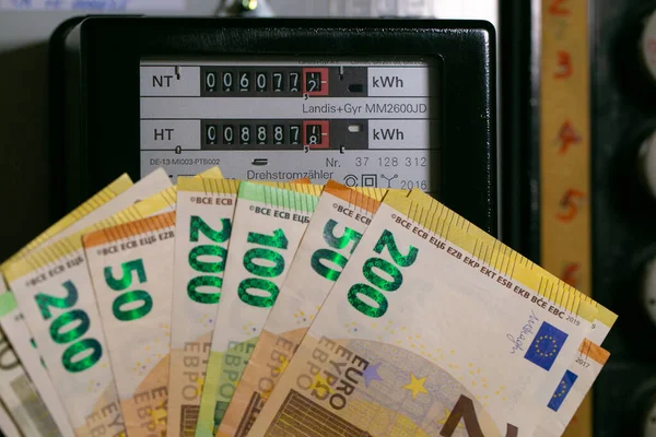 Electricity cost in Europe. euro bills on electric meter background. Rising electricity prices.Paying electricity bills in Europe. Payment for utility services
